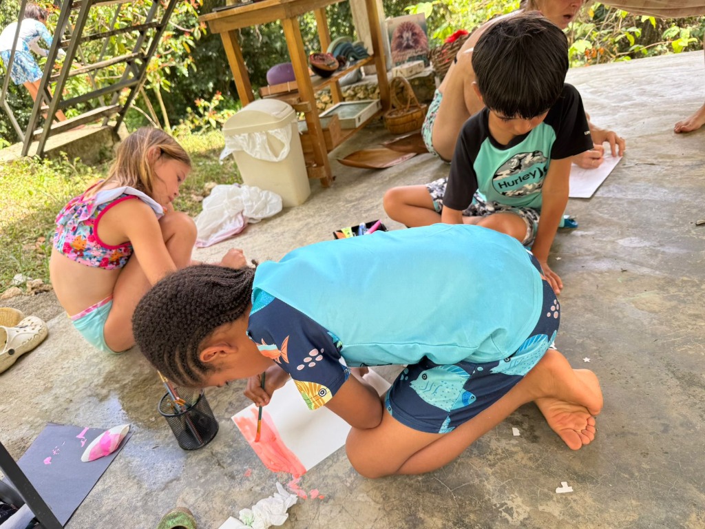 Children drawing and painting at Blossom Forest School